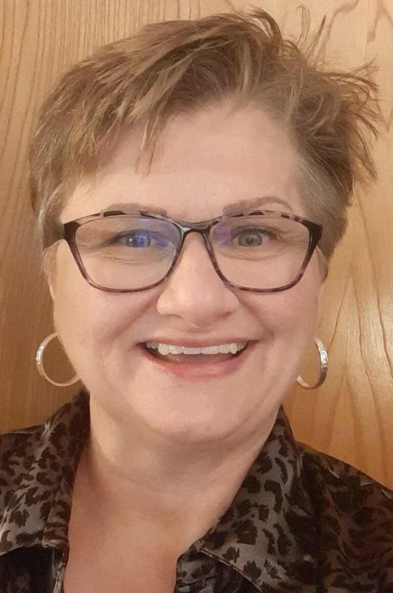 Melanie 2022 headshot 1 768x1159